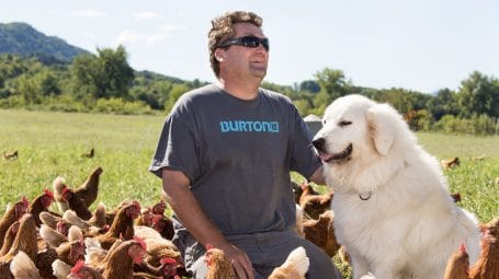 Eric Rozendaal with dog and chickens