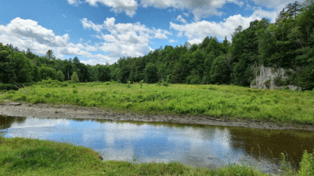 View of river with open land on either side - Missisquoi River Vermont