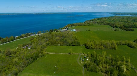 aerial view of farm fields alongside large lake - Grand Isle Vermont