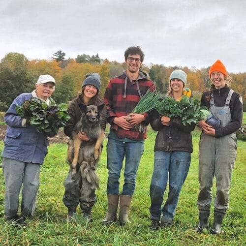 crew of five farmers holding crops - Blackbird Organics